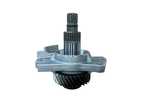 Close-up of a metal automotive differential assembly with gears and shaft on white background