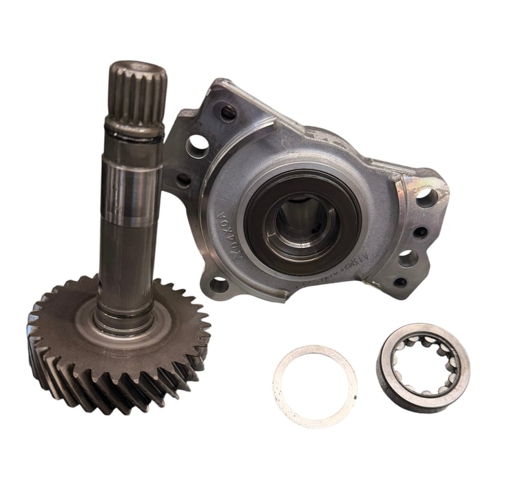 Automotive differential components including gear set, carrier housing, and seal ring on white background