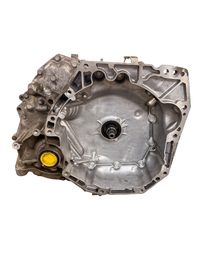 Aluminum engine transmission housing with integrated cooling passages and yellow fluid cap